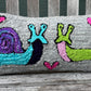 Tufted Snail and Slug Love Pillow