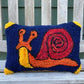 Tufted Red and Orange Snail Pillow